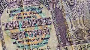 Rupee slides to record low near 90; RBI seen guarding the line